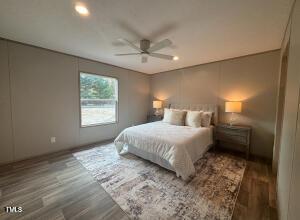 4285 Autry Mill Rd, Godwin, NC 28344 - bedroom featuring wood finished floors and a ceiling fan