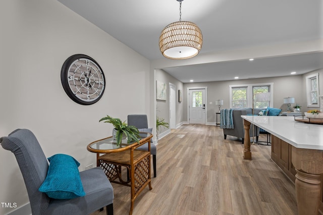 interior space featuring baseboards, recessed lighting, and light wood-style floors