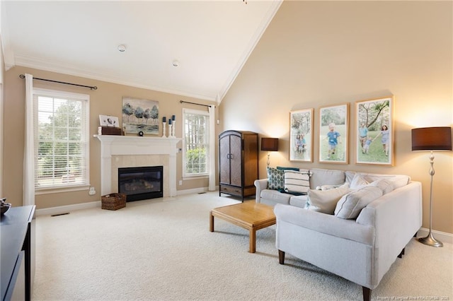 308 St Martins Pl, Fayetteville, NC 28311 - carpeted living area featuring high vaulted ceiling, a tiled fireplace, ornamental molding, and baseboards