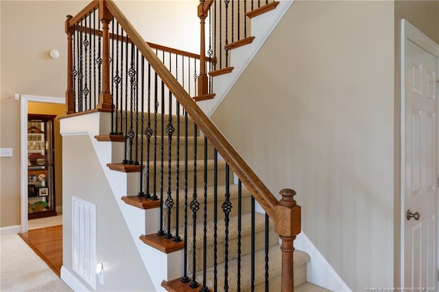 308 St Martins Pl, Fayetteville, NC 28311 - stairs with visible vents, baseboards, and a high ceiling