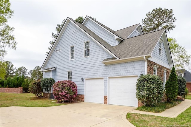 308 St Martins Pl, Fayetteville, NC 28311 - view of side of home with concrete driveway, roof with shingles, a garage, and a lawn
