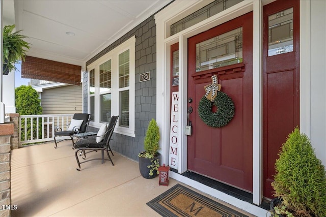 entrance to property featuring a porch