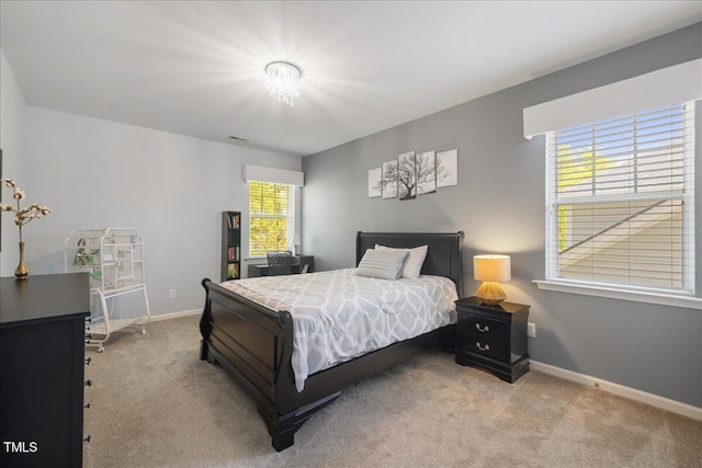 carpeted bedroom with baseboards