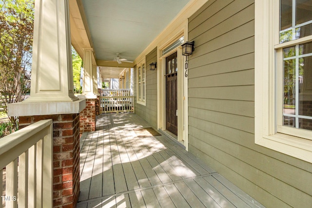 2106 Cloud Cover Ln, Raleigh, NC 27614 - wooden terrace featuring a porch and ceiling fan