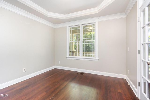2106 Cloud Cover Ln, Raleigh, NC 27614 - spare room with visible vents, baseboards, wood finished floors, and ornamental molding