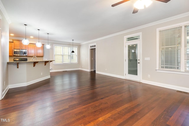 2106 Cloud Cover Ln, Raleigh, NC 27614 - unfurnished living room featuring a ceiling fan, crown molding, baseboards, dark wood-style flooring, and visible vents