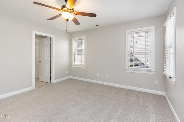 2106 Cloud Cover Ln, Raleigh, NC 27614 - unfurnished bedroom with baseboards, visible vents, a ceiling fan, and light colored carpet