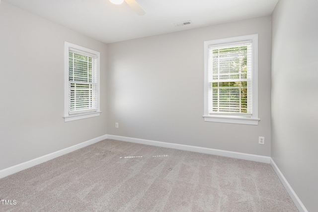 2106 Cloud Cover Ln, Raleigh, NC 27614 - unfurnished room with carpet, visible vents, and a wealth of natural light