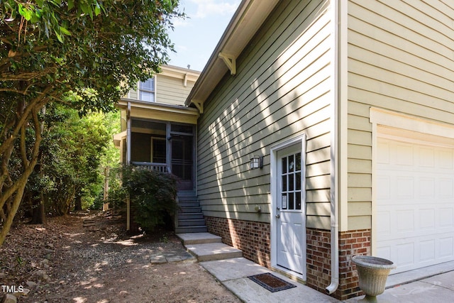 2106 Cloud Cover Ln, Raleigh, NC 27614 - view of property exterior featuring a sunroom and a garage