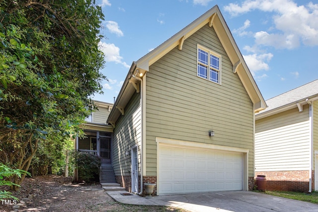 2106 Cloud Cover Ln, Raleigh, NC 27614 - view of home's exterior featuring driveway and a garage