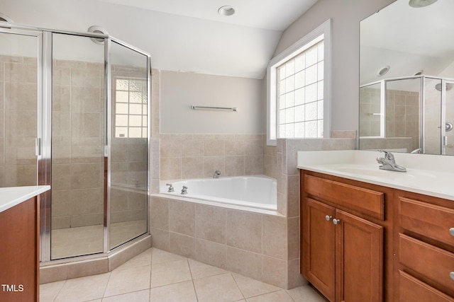2106 Cloud Cover Ln, Raleigh, NC 27614 - bathroom with a bath, tile patterned floors, vaulted ceiling, a shower stall, and vanity
