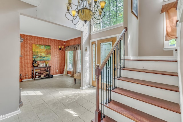 9332 Leslieshire Dr, Raleigh, NC 27615 - tiled entrance foyer featuring an inviting chandelier, a towering ceiling, stairway, wallpapered walls, and baseboards