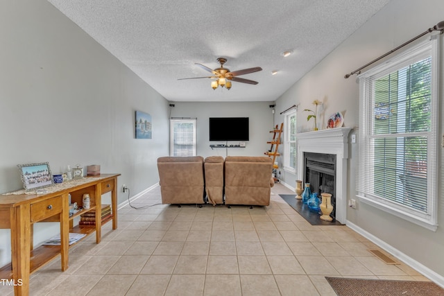 9332 Leslieshire Dr, Raleigh, NC 27615 - living room with a textured ceiling, a ceiling fan, and a healthy amount of sunlight