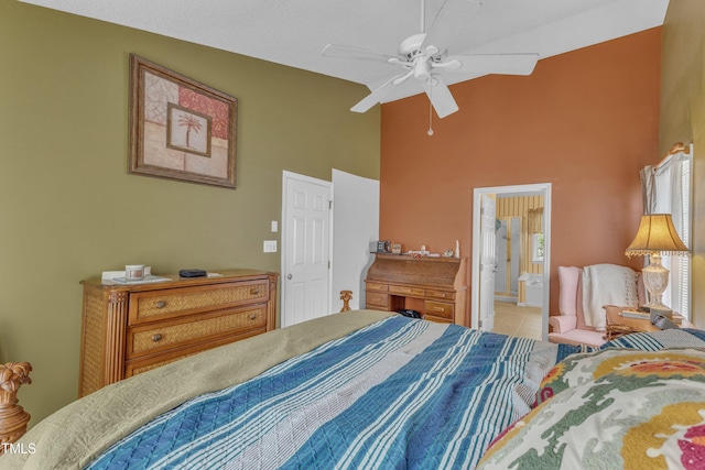 9332 Leslieshire Dr, Raleigh, NC 27615 - bedroom featuring ceiling fan, light tile patterned floors, a towering ceiling, and connected bathroom