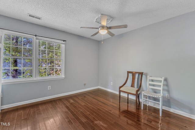9332 Leslieshire Dr, Raleigh, NC 27615 - unfurnished room featuring wood-type flooring, visible vents, a textured ceiling, and a ceiling fan