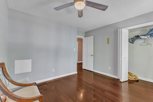9332 Leslieshire Dr, Raleigh, NC 27615 - unfurnished room featuring ceiling fan, baseboards, hardwood / wood-style flooring, and a textured ceiling
