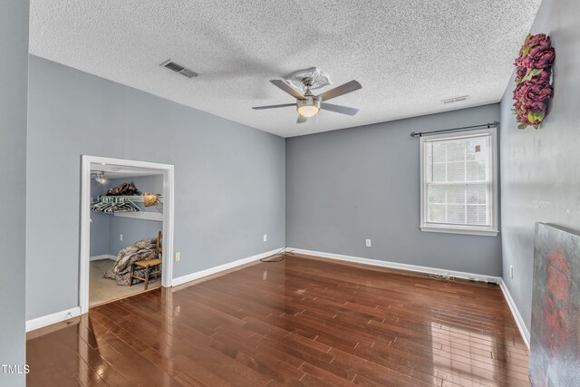 9332 Leslieshire Dr, Raleigh, NC 27615 - empty room with visible vents, baseboards, a ceiling fan, and wood finished floors