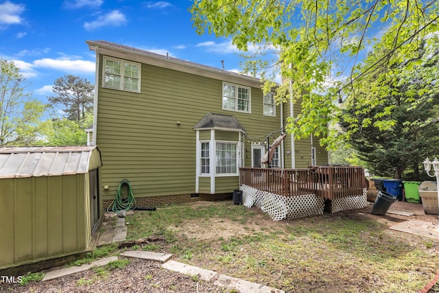 9332 Leslieshire Dr, Raleigh, NC 27615 - rear view of property with a shed, a deck, and an outdoor structure