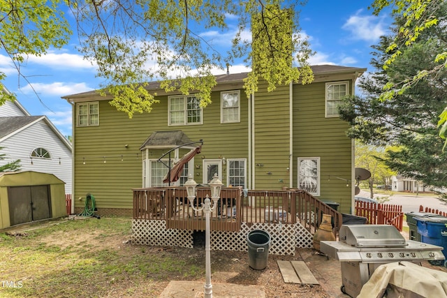 9332 Leslieshire Dr, Raleigh, NC 27615 - rear view of house featuring a storage shed, an outbuilding, and a deck