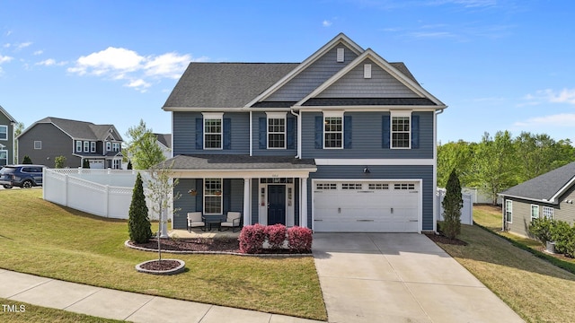 view of front facade featuring covered porch, driveway, and a garage