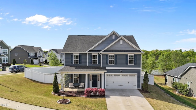view of front of property with covered porch, driveway, an attached garage, and a residential view