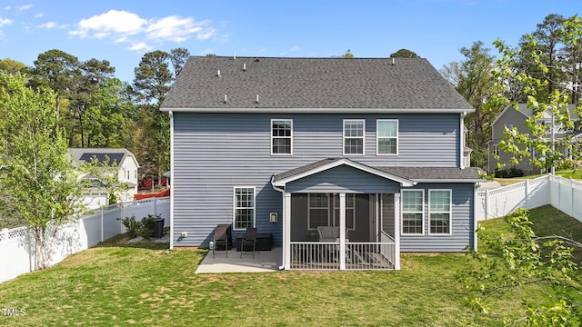 back of house with a patio and a sunroom