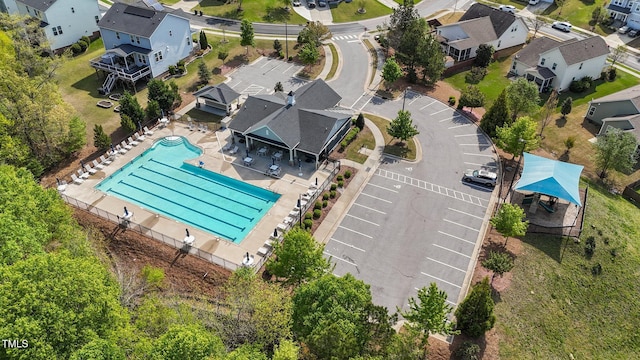aerial view of residential area with a pool area