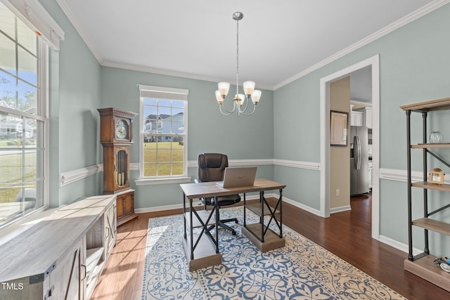 office area with wood finished floors, ornamental molding, baseboards, and a chandelier