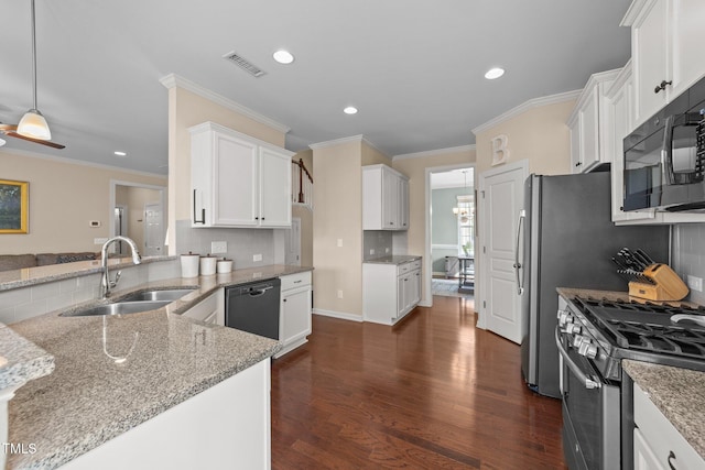 kitchen featuring black appliances, a sink, decorative backsplash, white cabinets, and light stone countertops
