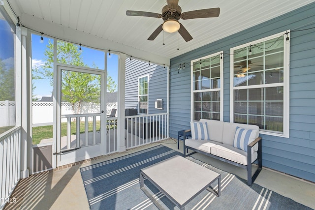 sunroom with an outdoor hangout area, ceiling fan, and healthy amount of natural light