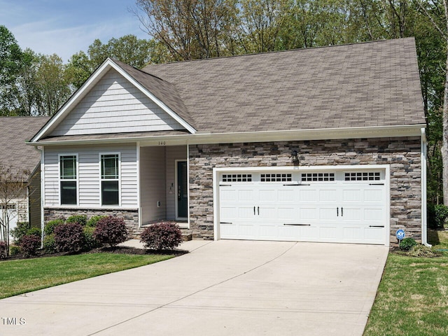 140 Clear Water Rd, Louisburg, NC 27549 - craftsman-style house featuring a front yard, a shingled roof, stone siding, a garage, and driveway