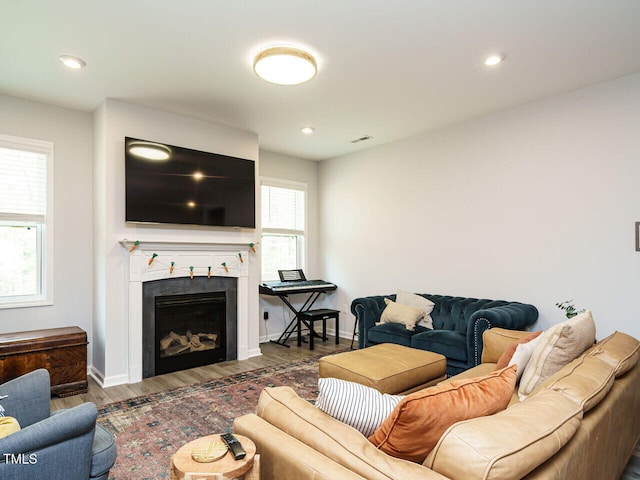 140 Clear Water Rd, Louisburg, NC 27549 - living room with baseboards, recessed lighting, wood finished floors, and a fireplace