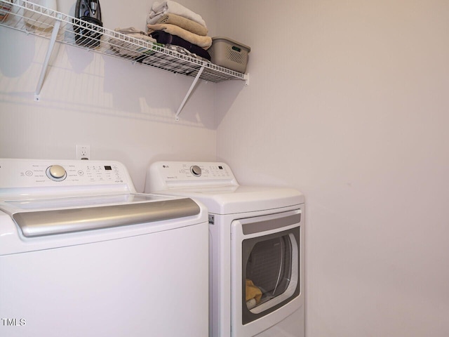 140 Clear Water Rd, Louisburg, NC 27549 - laundry room with laundry area and washing machine and clothes dryer
