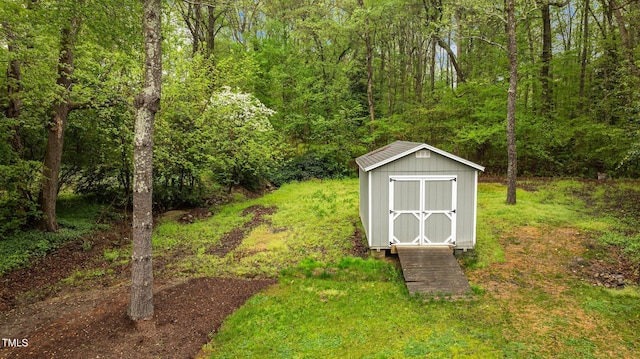 view of shed featuring a forest view