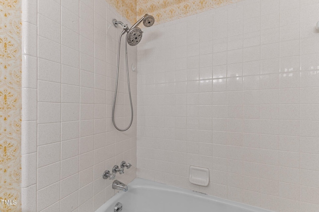 bathroom featuring shower / washtub combination and wallpapered walls