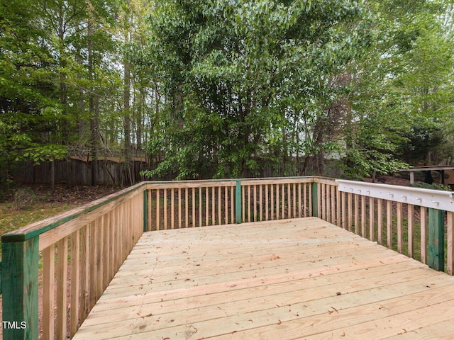 wooden deck featuring fence