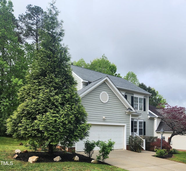 view of front of house featuring a garage and concrete driveway