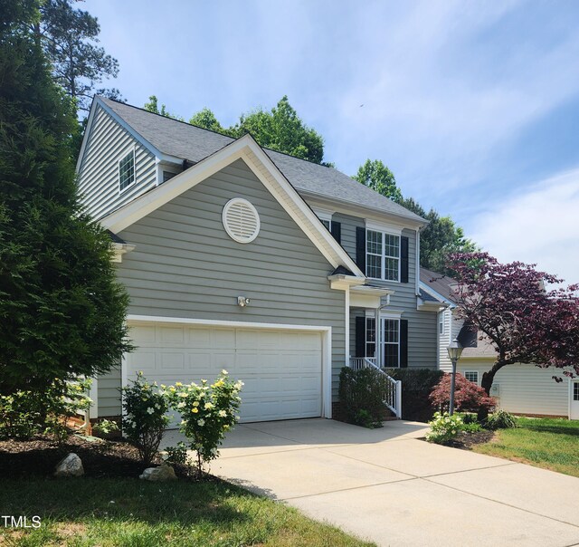 view of front facade featuring concrete driveway
