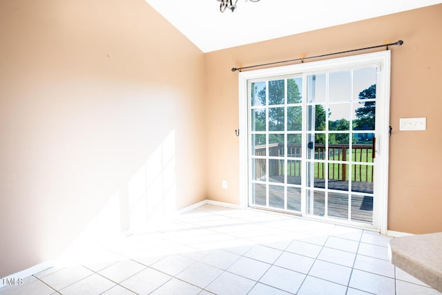 78 Cross Creek Ct, Timberlake, NC 27583 - empty room with vaulted ceiling, baseboards, and light tile patterned flooring
