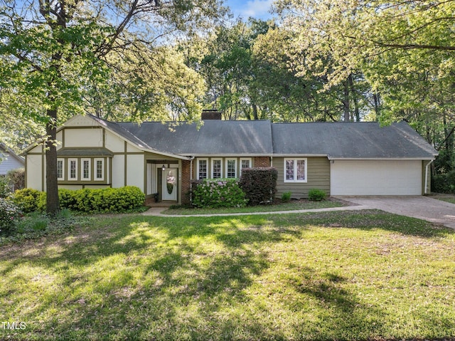 1304 Deboy St, Raleigh, NC 27606 - view of front of property with driveway, a chimney, an attached garage, and a front lawn
