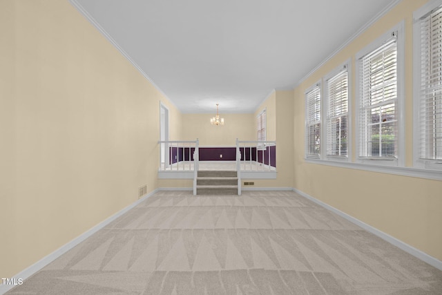 1304 Deboy St, Raleigh, NC 27606 - interior space with ornamental molding, visible vents, an inviting chandelier, and light carpet