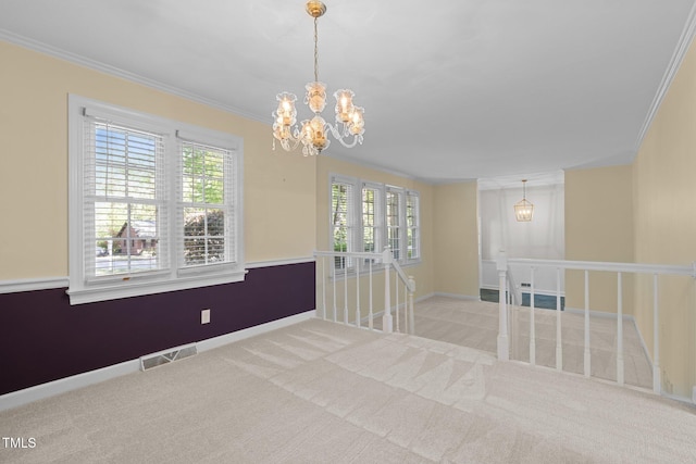 1304 Deboy St, Raleigh, NC 27606 - carpeted empty room featuring baseboards, crown molding, a notable chandelier, and visible vents