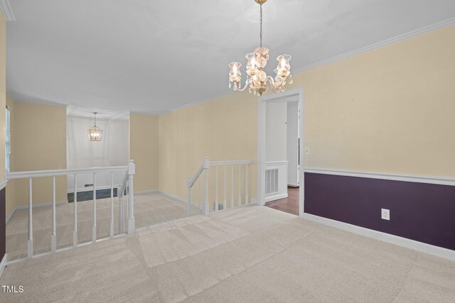 1304 Deboy St, Raleigh, NC 27606 - unfurnished room featuring a chandelier, carpet, visible vents, and crown molding