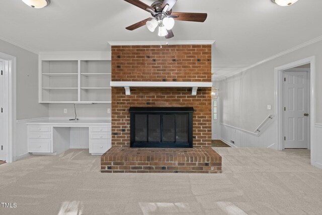 1304 Deboy St, Raleigh, NC 27606 - unfurnished living room with ornamental molding, built in features, carpet flooring, and ceiling fan