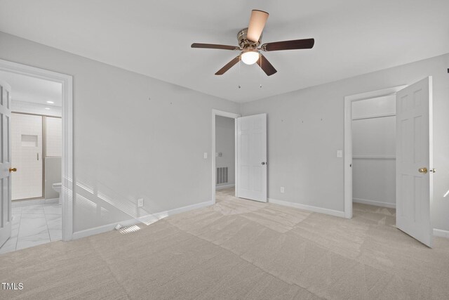 1304 Deboy St, Raleigh, NC 27606 - unfurnished bedroom featuring visible vents, baseboards, a closet, ensuite bathroom, and a spacious closet