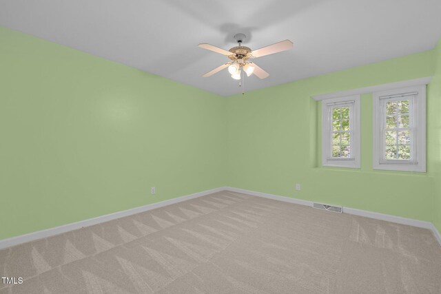 1304 Deboy St, Raleigh, NC 27606 - unfurnished room with visible vents, ceiling fan, light carpet, and baseboards