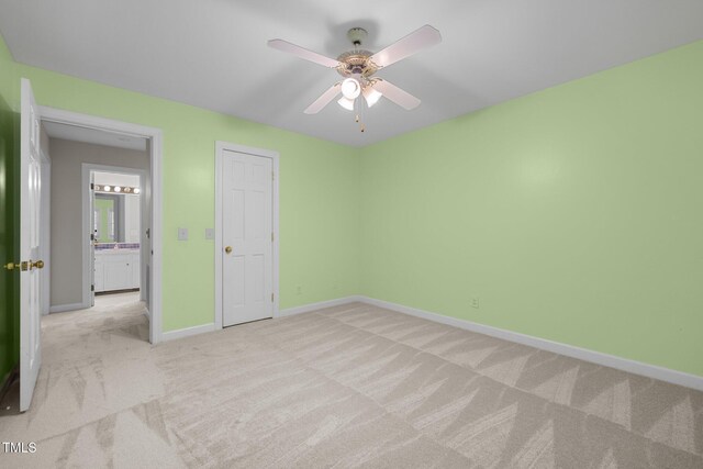 1304 Deboy St, Raleigh, NC 27606 - unfurnished bedroom with light colored carpet, baseboards, and ceiling fan