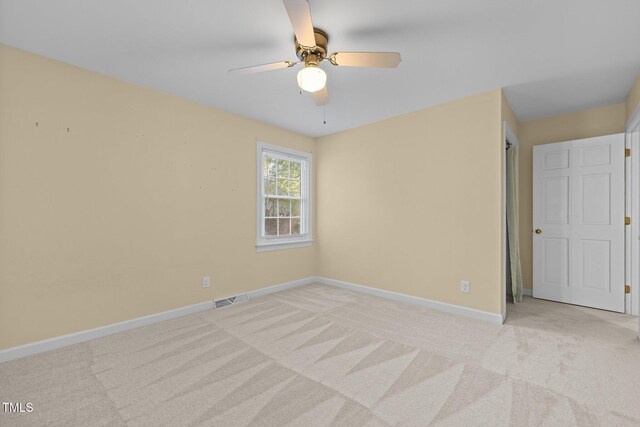 1304 Deboy St, Raleigh, NC 27606 - spare room featuring visible vents, ceiling fan, light colored carpet, and baseboards