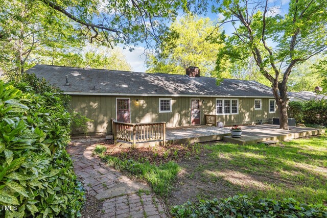 1304 Deboy St, Raleigh, NC 27606 - rear view of house featuring a deck and a chimney