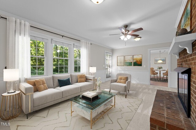 1304 Deboy St, Raleigh, NC 27606 - living area featuring ornamental molding, a ceiling fan, a wainscoted wall, a brick fireplace, and a decorative wall